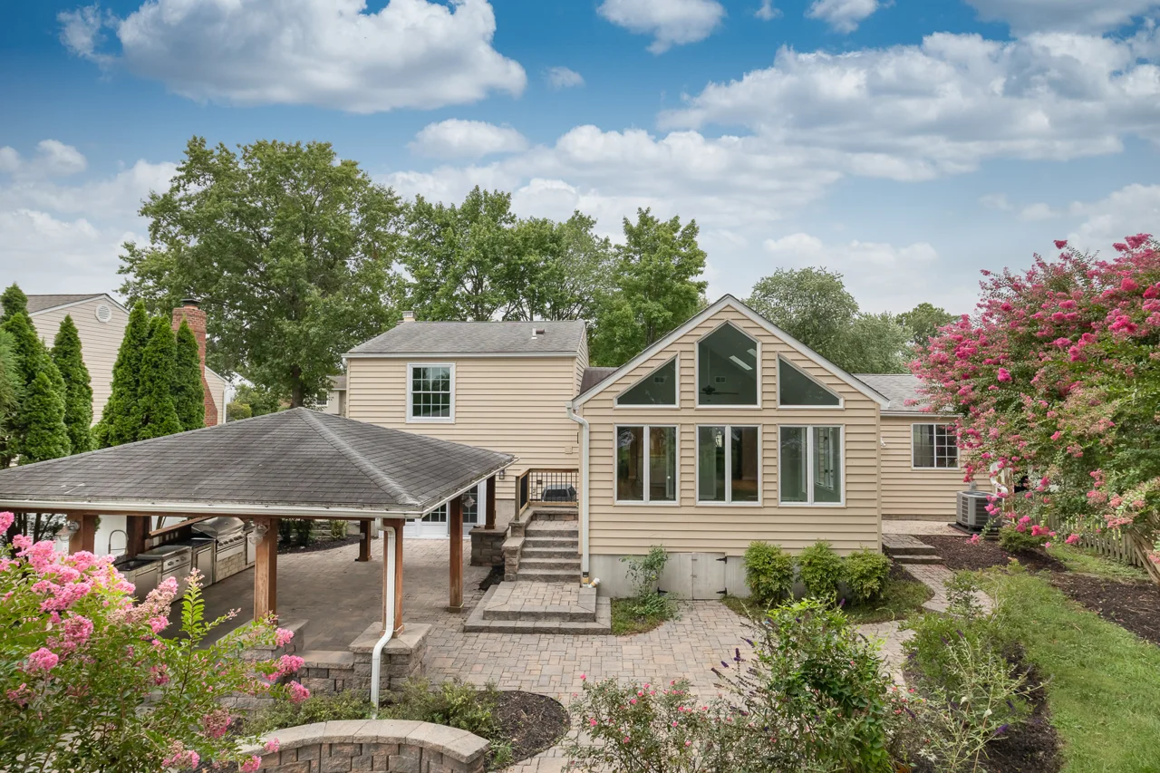Sunroom and covered patio from the yard