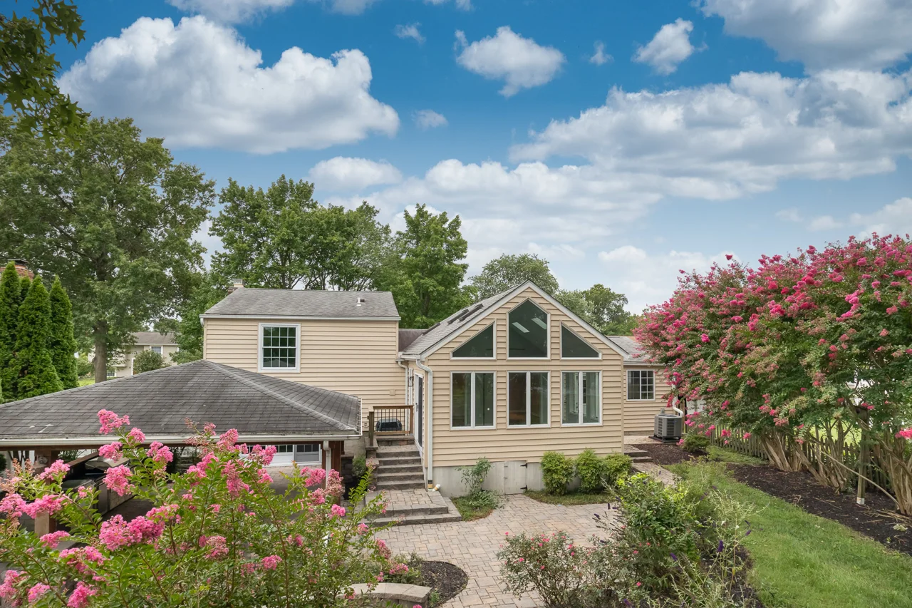 Rear roofline and sunroom windows