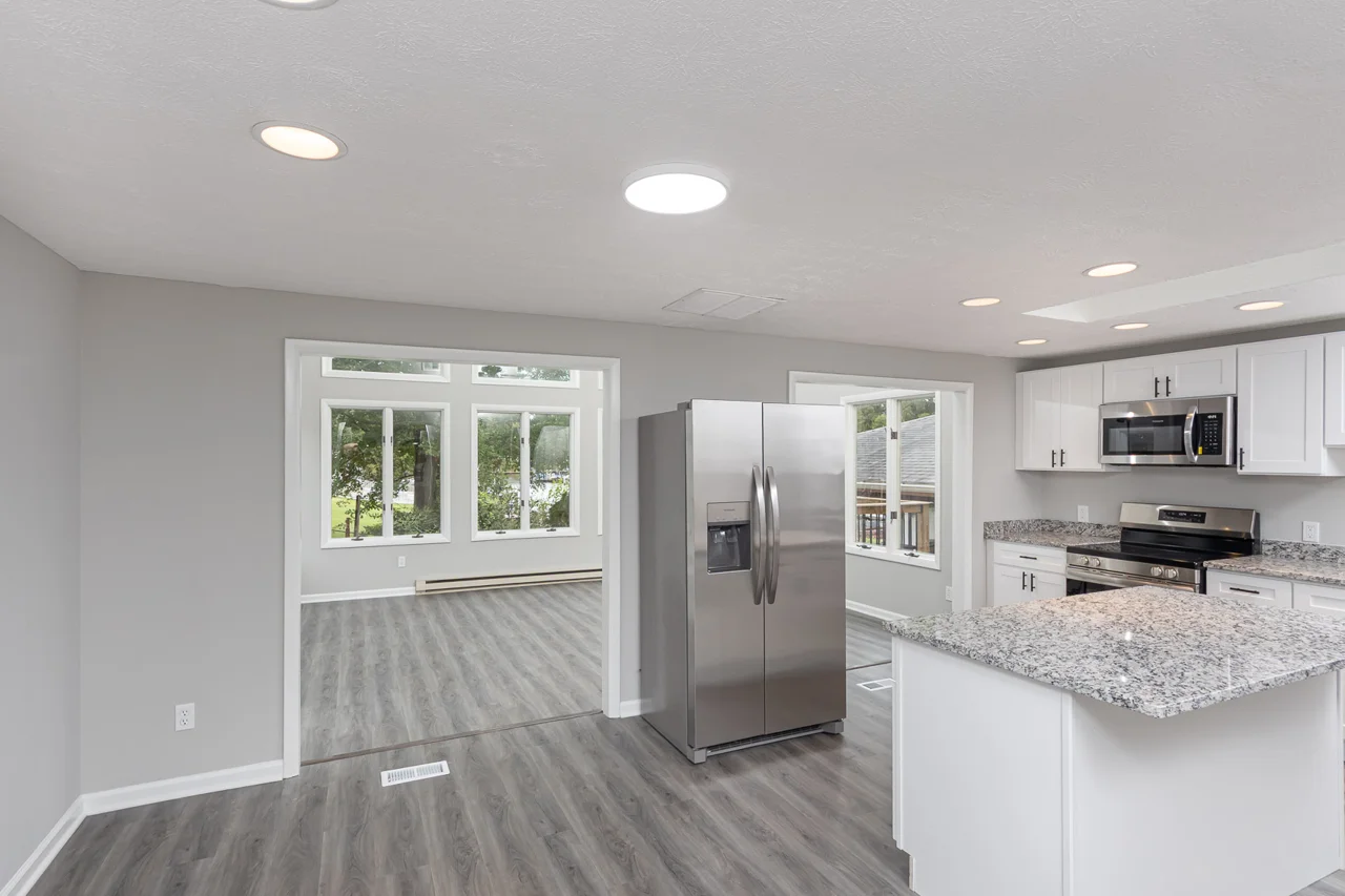 Kitchen opening toward the sunroom