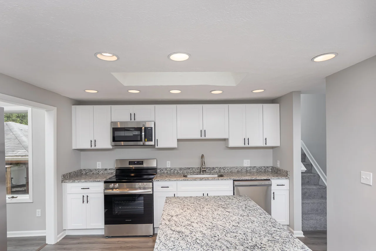 White cabinetry and kitchen island