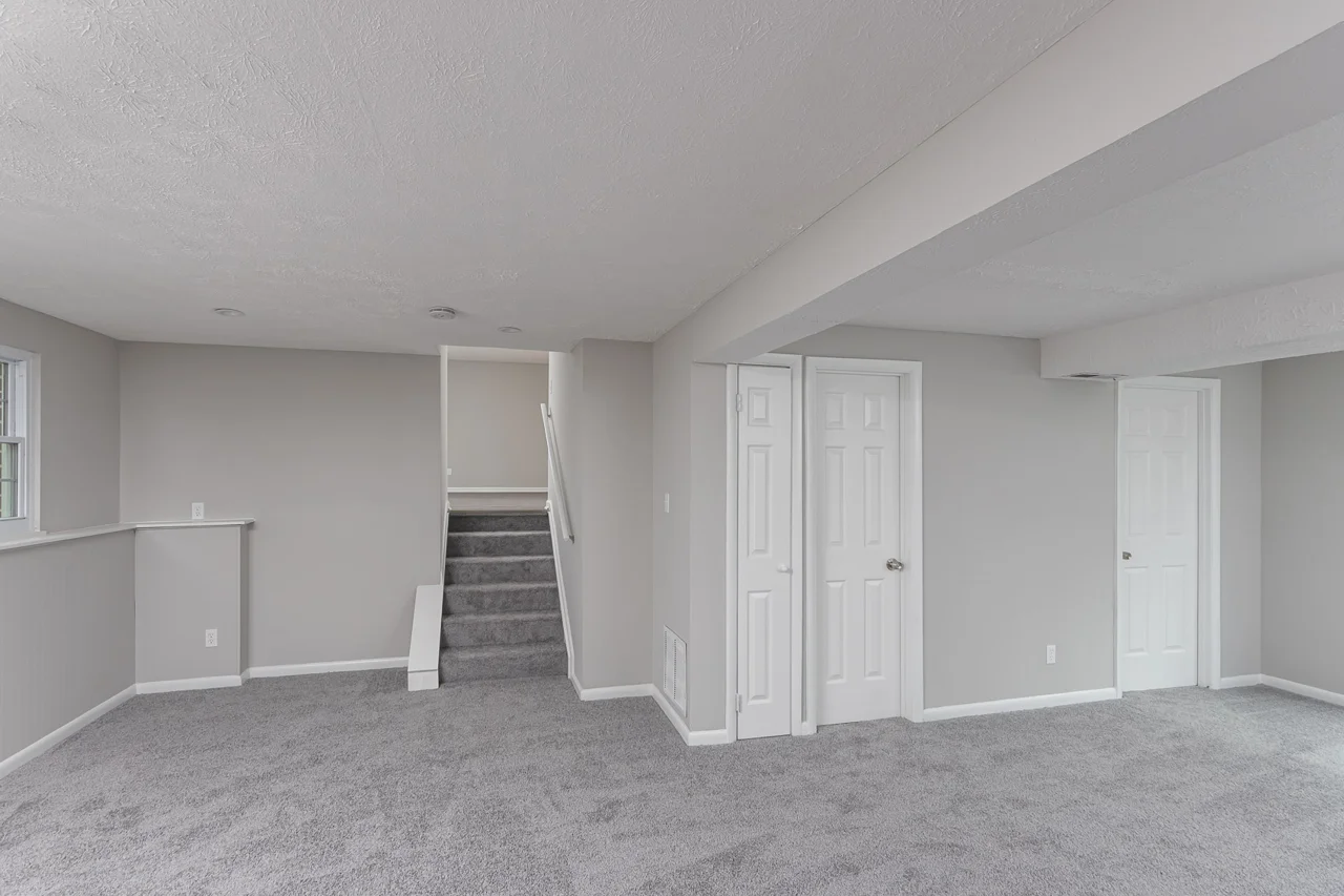 Lower-level room and stairs