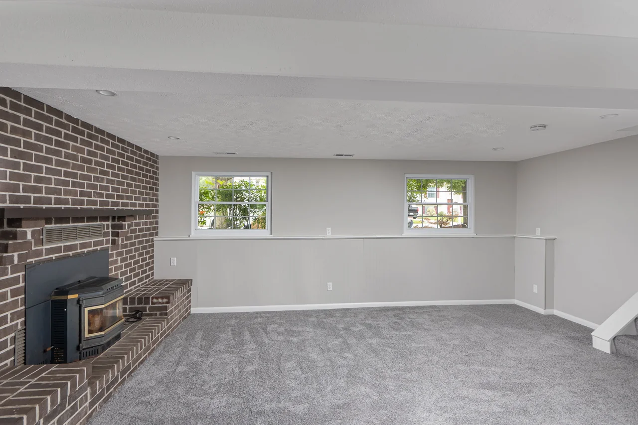 Lower-level windows and brick hearth