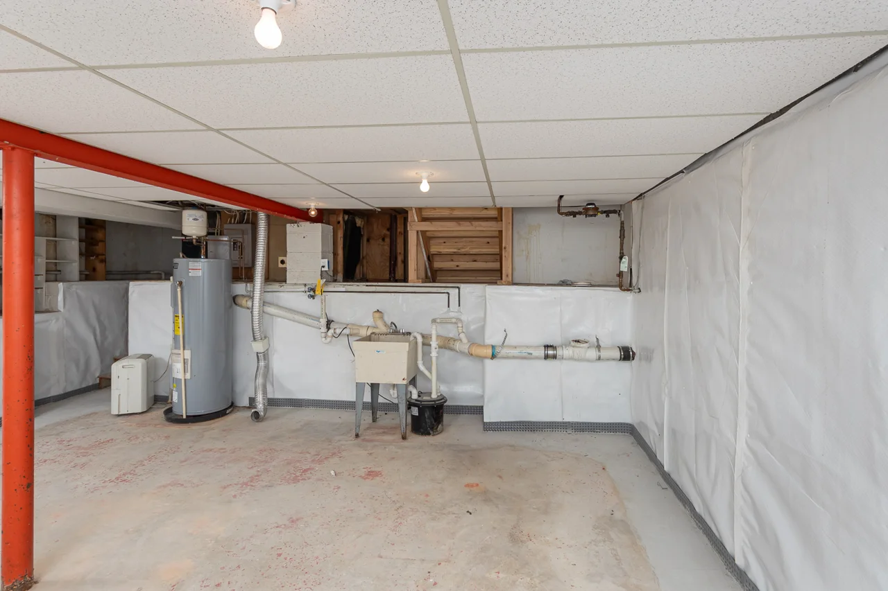 Unfinished utility and laundry area